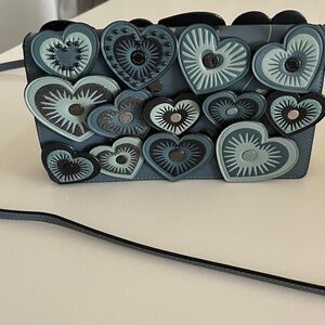 Hayden Foldover Crossbody Clutch With Hearts. Used once. Excellent condition.